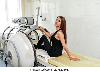 A woman in an oxygen pressure chamber is being treated. Treatment of pneumonia and covid. - Shutterstock ID 2075205937