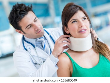 Woman In Pain At The Doctor For A Neck Injury