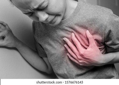 Woman With Pain At The Heart. Young Woman With Heart Disease. Woman Have Symptoms Of Heart Attack, Congestive Heart Failure.