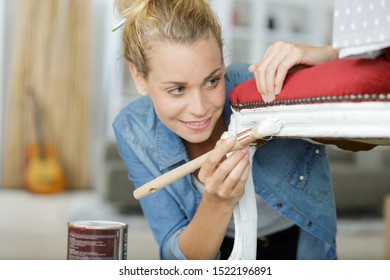 A Woman Painting Antique Chair