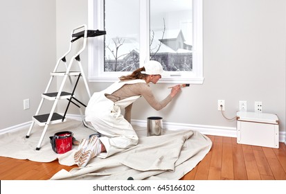 Woman Painting Trim