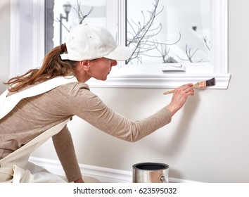 Woman Painting Wall