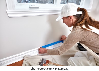 Woman Painting Wall