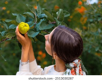 woman in park posing with melon,holding fruit on eyes or below waist.girl with picnic accessories, autumn fruit as strawberry.female drinking tea,pouring from vintage kettle.bush with yellow berries. - Powered by Shutterstock