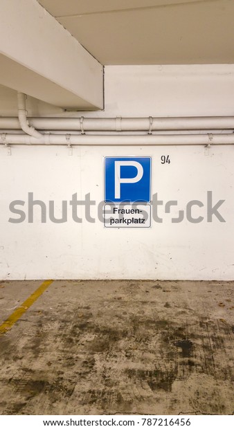 Woman parking in the\
parking garage