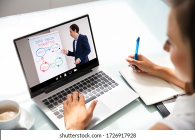 Woman Participating In Online Coaching Session Using Laptop