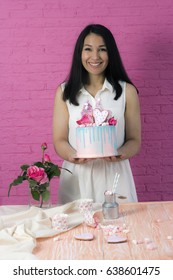 Woman Pastry Chef Holds A Birthday Cake