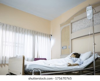 Woman Patient In Hospital Bed 