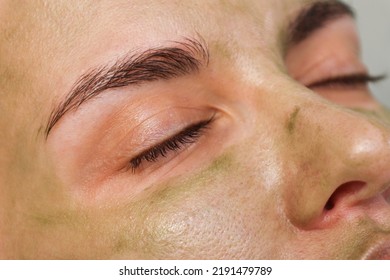 Woman Patient Portrait, Prepared For LED Phototherapy For The Face. Girl With Green Gel With Seaweed Photosensitizer. Facial Care. Light Therapy In Clinic, Anti-age Procedure. Face Closeup