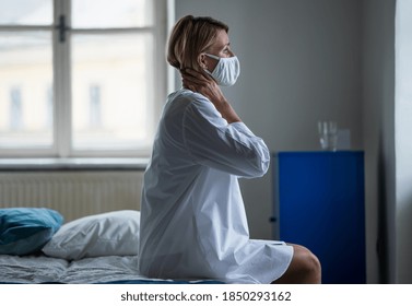 Woman Patient Sitting On Bed In Hospital Feeling Stressed, Mental Health And Coronavirus Concept.