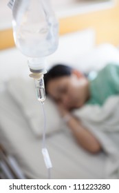 Woman Patient Sleeping In Hospital Bed