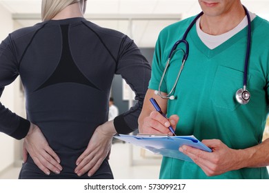 Woman Patient Suffering From Back Pain During Medical Exam By Doctor . Rehabilitation After Sports Exercising Injury. Physical Therapy.