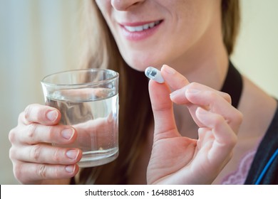 Woman Patient Swallowing Capsule Endoscopy Video Pill With Water