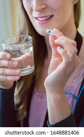 Woman Patient Swallowing Capsule Endoscopy Video Pill With Water