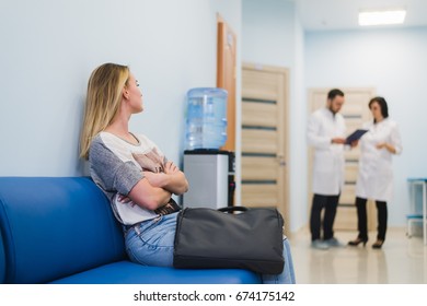 Woman Patient Waiting At Hospital Doctors Waiting Room