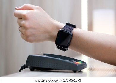 Woman Pay By Smart Watch With NFC Technology.
