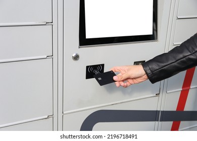 Woman Pay Package By Credit Card In Her Hands Near The Self-service Mail Terminal. Parcel Delivery Machine.