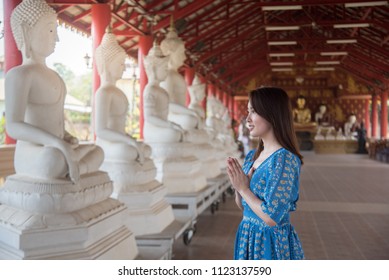 A Woman Pay Respect To Buddha