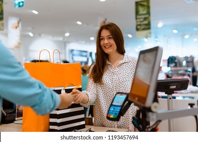 Woman paying for apparel in store