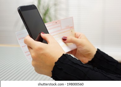 Woman Is Paying Bill On Mobile Smart Phone