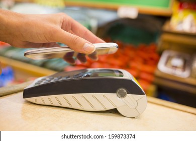 Woman Paying With Nfc Technology On Mobile Phone In Supermarket, Electronic Reader 