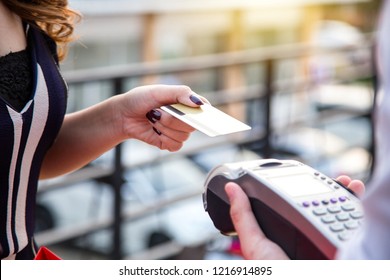 Woman Payment Via Credit Card Swipe Machine.