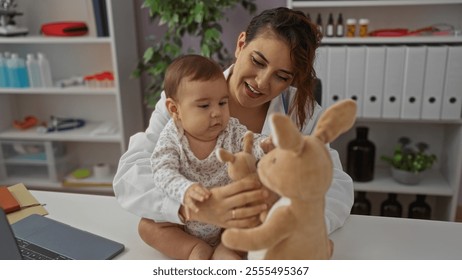 Woman pediatrician interacting with baby and toddler on clinic table indoors, featuring healthcare professional playing with children, creating a friendly medical environment. - Powered by Shutterstock