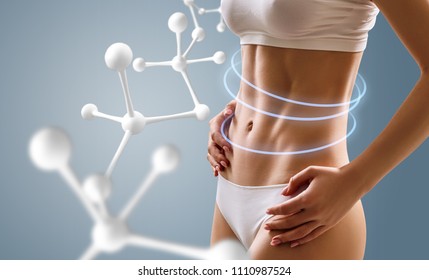 Woman With Perfect Body Near Big Molecule Chain. Slimming Concept. Improvement Of Metabolism Concept.