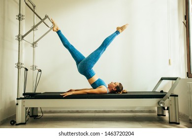 Woman Performing Pilates Exercise Using Cadillac Stock Photo (Edit Now ...