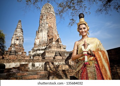Woman Performing Typical Thai Dance With Thai Style Temple Background, Identity Culture Of Thailand