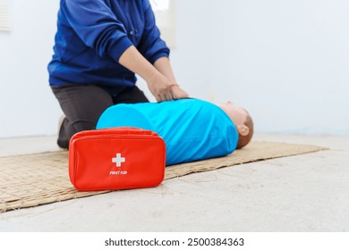 A woman performs chest compressions on a dummy during a CPR training class, demonstrating life-saving techniques and emergency response skills to ensure preparedness in critical situations. - Powered by Shutterstock