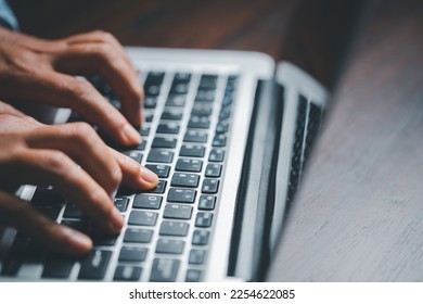 Woman person hands with laptop computer on wooden table for business or technology background. - Shutterstock ID 2254622085