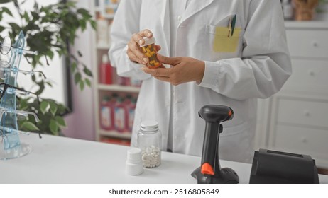 A woman pharmacist examines a bottle of pills at a pharmacy counter, surrounded by various medications and a barcode scanner. - Powered by Shutterstock