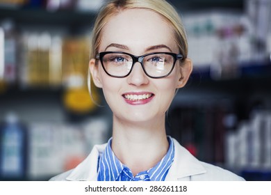 woman pharmacist smiling - Shutterstock ID 286261118