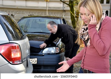 Woman phoning with police or insurance after accident with car - Powered by Shutterstock