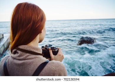 Woman photographer sea