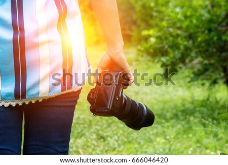 Woman photographer takes photo