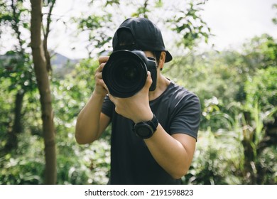 Woman photographer taking pictures in summer mountains - Shutterstock ID 2191598823