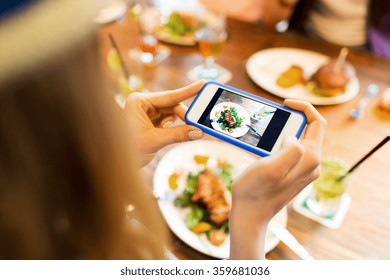 woman photographing food by smartphone  - Powered by Shutterstock