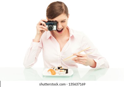 Woman photographing sushi - Powered by Shutterstock