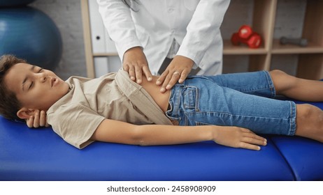 A woman physiotherapist treating a young boy patient in a rehab clinic room, with focus on care and therapy. - Powered by Shutterstock