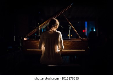 Woman at Piano - Powered by Shutterstock