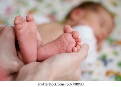 The Woman Picked Up The Little Baby Feet