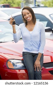 Woman Picking Up New Car From Lot