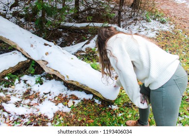 Woman Picking Up Snow 