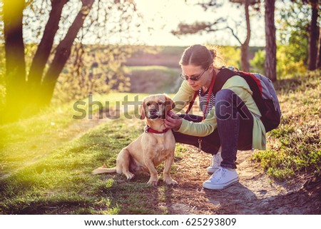 Woman picking a tick on dog fur