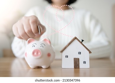 Woman With Piggy Bank Connect With Heart Shape Line To Future House Concept Of Saving And Loan Money For House. To Rent Or Buy New House With Saving Money In Piggy Bank.