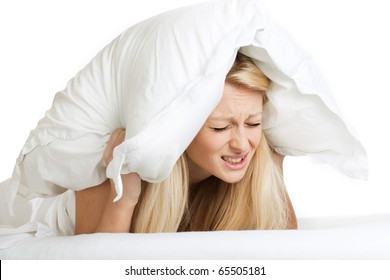 Woman With A Pillow Over Her Head, Has Trouble Sleeping.