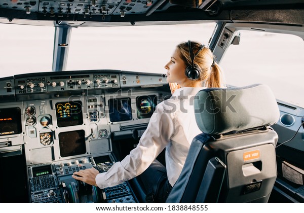 Woman Pilot Sitting Airplane Cockpit Wearing Stock Photo 1838848555 ...