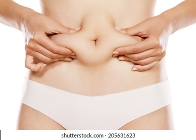 Woman Pinching Her Stomach